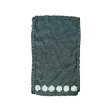 Beautiful hand-dyed itajime hemp moon linen hand towel in muir woods with undyed circles by kamppinen laid flat